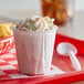 A small cup of crab salad on a table.