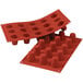 a red silicone tray with cups