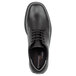 A black Rockport Works men's oxford dress shoe with laces.