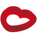 A red heart-shaped plastic cookie cutter.