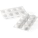 A white silicone baking mold with 8 rectangular cavities.