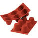 A red Silikomart silicone baking mold with six big muffin cavities.