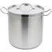 A large stainless steel Vollrath stock pot with handles and a lid.