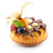 A dessert made in a Silikomart round waffle silicone mold with fruit on top.