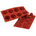 A red Silikomart silicone baking mold with 8 big cone-shaped cavities.