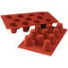 A red silicone baking mold with 11 medium baba cavities.