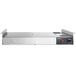 A silver rectangular ServIt double strip warmer with a button.