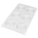A white silicone baking mold with spiral designs.