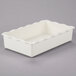 A white rectangular deli crock with scalloped edges.