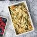 A GET Create-a-Bar Deli Crock filled with pasta and berries on a salad bar counter.