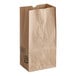 A brown Duro grocery bag with black text.