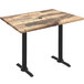 A Holland Bar Stool EnduroTop rustic wood laminate table with black end column base.