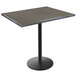 A Holland Bar Stool EnduroTop bar height table with a charcoal wood laminate top and black round base.
