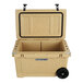 A beige CaterGator outdoor cooler with black wheels.