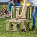 a close-up of a man painting a box