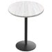 A white round Holland Bar Stool table top with a black round base.