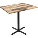 A Holland Bar Stool EnduroTop rustic wood laminate table with a black metal base.