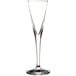 A close-up of a clear Stolzle liqueur glass with a long stem.