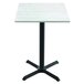 A Holland Bar Stool EnduroTop white ash wood laminate table with a black base.