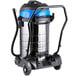 A Lavex stainless steel wet/dry vacuum cleaner on wheels.