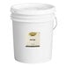 A white Golden Barrel 5 gallon bucket with a white label.