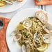 A plate of pasta with Rappahannock Oyster Co. Olde Salt littleneck clams and lemon slices.