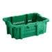 A green plastic Orbis agricultural crate with holes and handles.