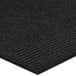 A close up of a Lavex Pepper Indoor Entrance Mat with a black stripe.