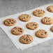 David's Cookies chocolate chip cookies on a white surface.