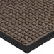 A brown Lavex Waffle indoor entrance mat with a black border.