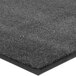 A close up of a gray Lavex Olefin carpet mat with black edges.