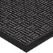 A close-up of a black rubber Lavex entrance mat with a pattern on it.