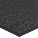 A Lavex charcoal indoor entrance mat with a black border and chevron pattern.