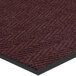 A burgundy Lavex carpet mat with a black border and chevron rib pattern.