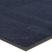 A Lavex navy blue olefin entrance mat with a black border.