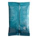 A blue and white package of Caribou Blend Decaf Coffee packets.