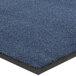 A close up of a blue Lavex Olefin entrance mat with a black border.