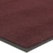 A burgundy Lavex Olefin entrance mat with black border.