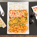 An American Metalcraft wavy rectangular stoneware platter with a plate of food on a table.