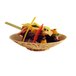 A Solia bamboo leaf bowl filled with food on a table.