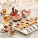 A table with Solia dome supports and mini desserts.