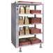 A Hatco heated shelf with boxes of pizza on it.