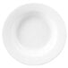 A close-up of a white Chef & Sommelier soup plate with a white border.