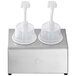 A silver Steril-Sil condiment dispenser kit with white plastic containers and pump lids on a stand.