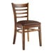 A Lancaster Table & Seating wooden ladder back chair with dark brown vinyl seat