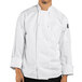 A man wearing a white Uncommon Chef long sleeve chef coat.