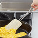 a white spatula on a pan