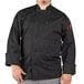 A man wearing a black Uncommon Chef long sleeve chef coat.