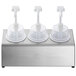 A Steril-Sil stainless steel condiment dispenser with white plastic containers and dome top pump lids.