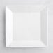 An Acopa bright white square porcelain plate on a white surface.